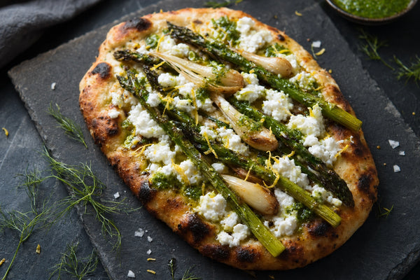 Charred asparagus and ramp flatbread with goat cheese