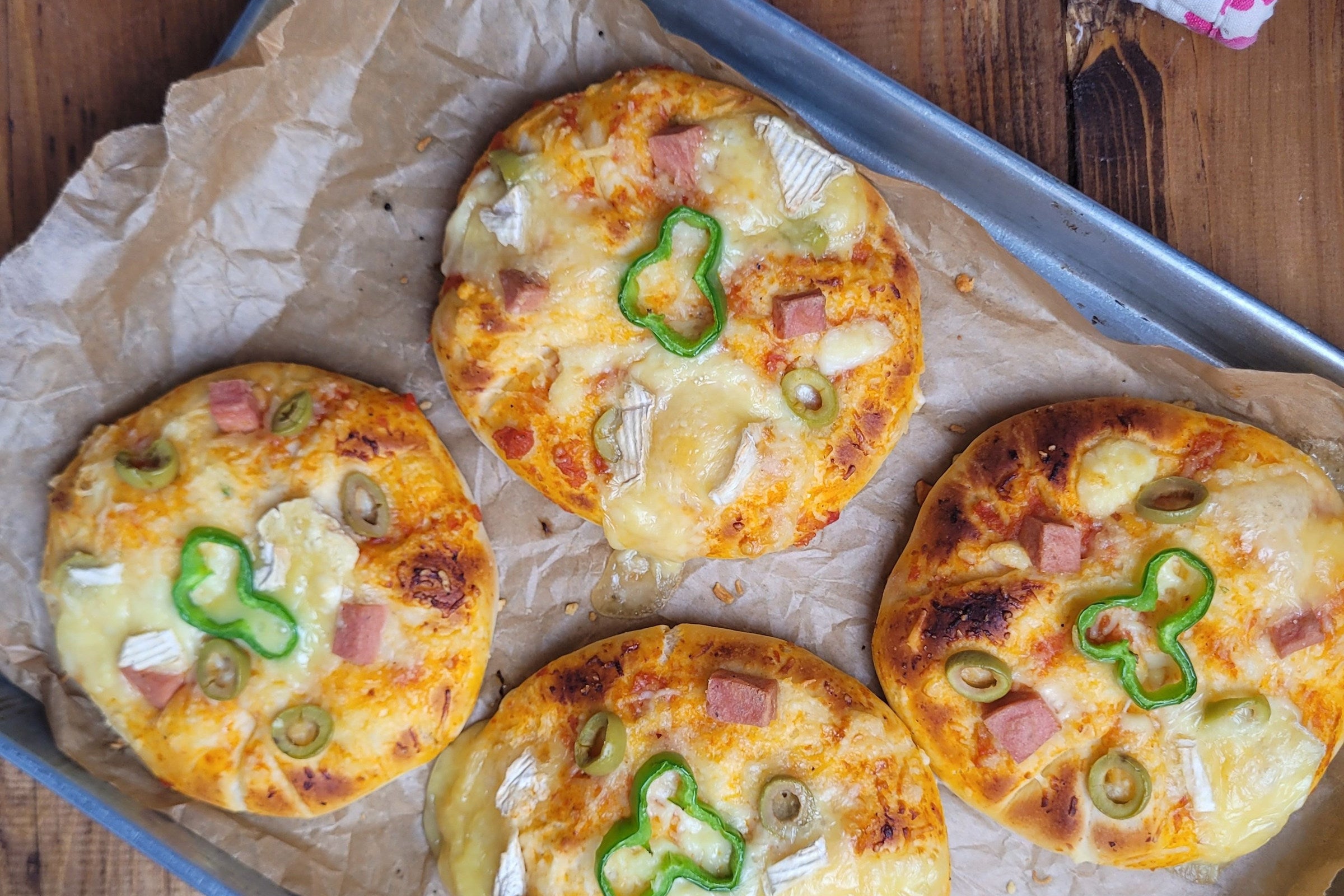 Four small pizzas are visible