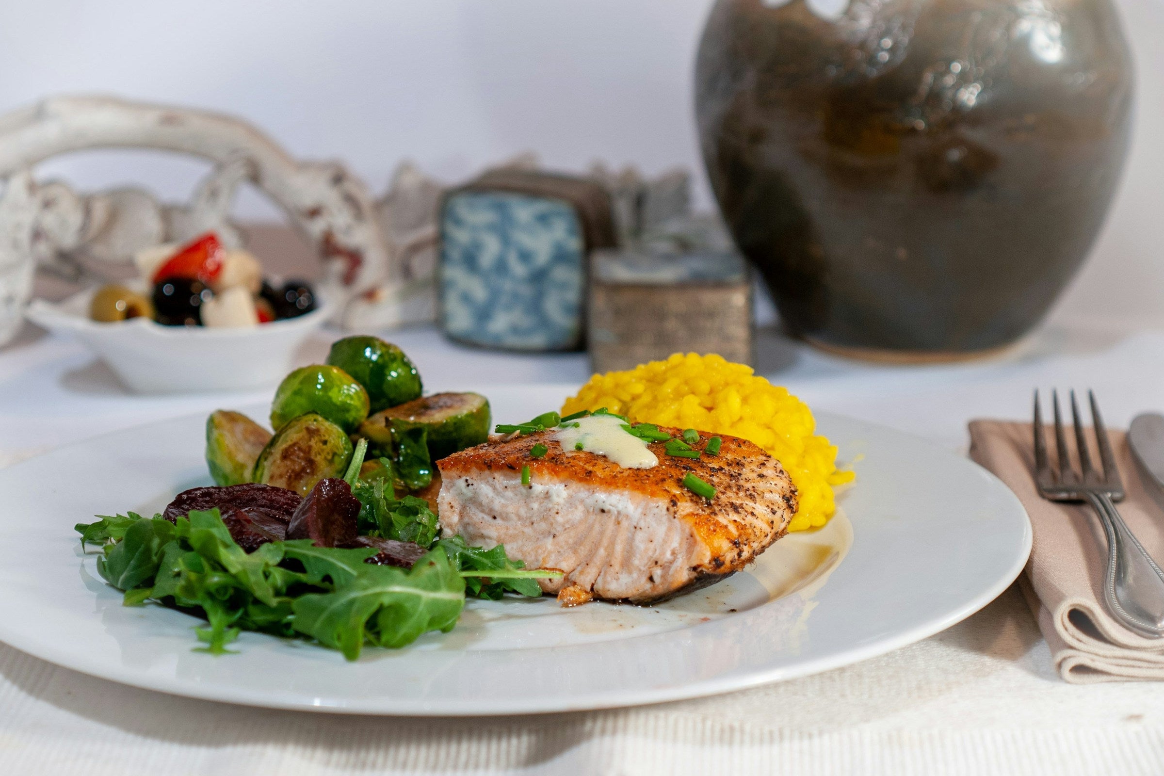 Salmon, rice and greens are visible