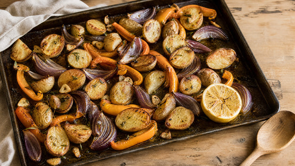 Crispy German Butterball potatoes roasted with orange peppers and Tropea onions