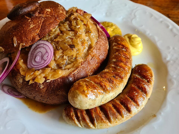 Brats with Warm Sauerkraut, Muenster and Toasted Ciabatta