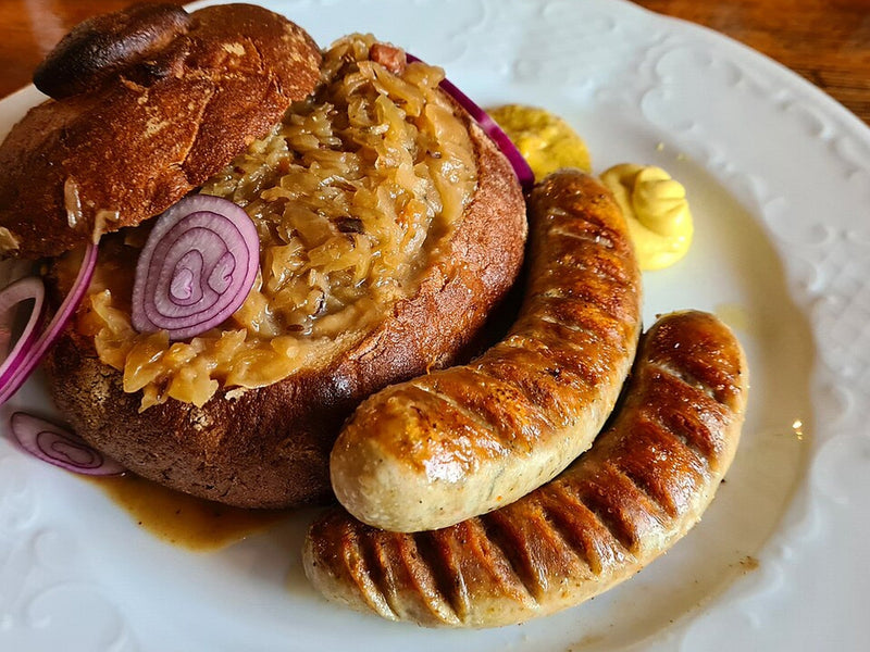 Brats with Warm Sauerkraut, Muenster and Toasted Ciabatta