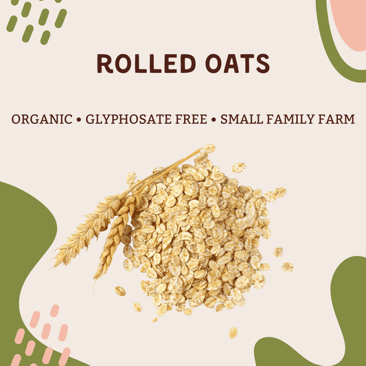 Organic Rolled Oats (32oz) displayed with wheat, showcasing a wholesome, glyphosate-free product from a small family farm.