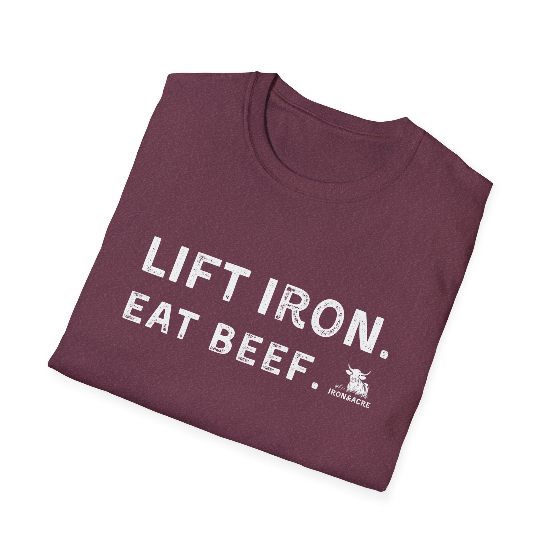 Folded maroon unisex t-shirt with 'Lift Iron. Eat Beef.' print, ideal for gym lovers and casual wear.